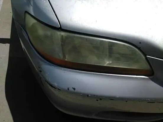 Oxidised, yellowed headlight lens before restoration