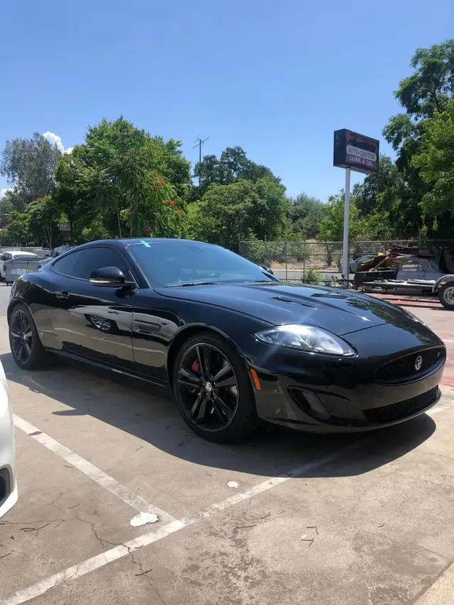 Black Jaguar XK parked in the lot